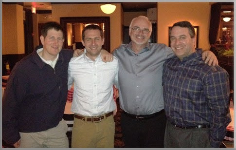 The original four founders of FastSpring stand arm in arm.