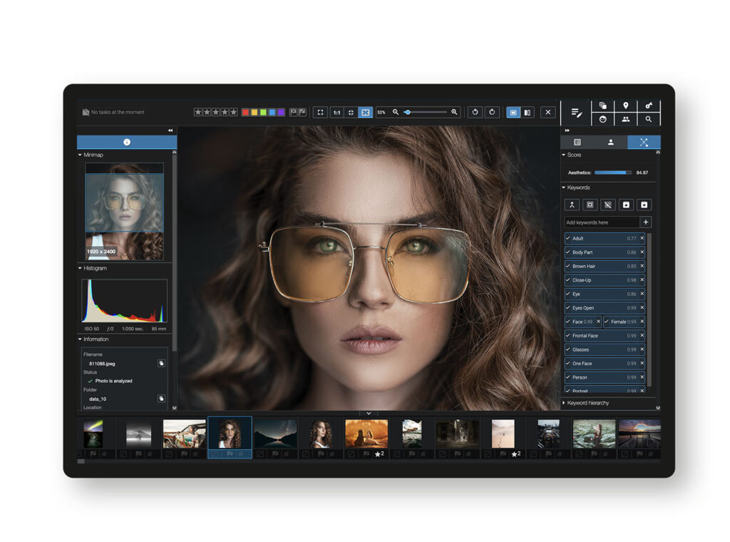 Screenshot of Excire software showing menus on each side and a photo of a brown-haired woman wearing yellow tinted sunglasses.